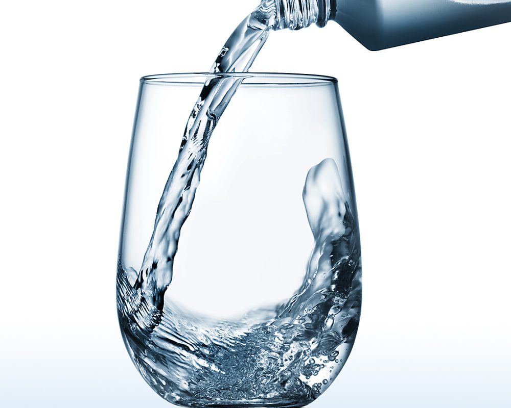 Voss water pouring in a glass photo by Jens Johnson Photography. Premium food, beverage, and product photography for Connecticut and New York.